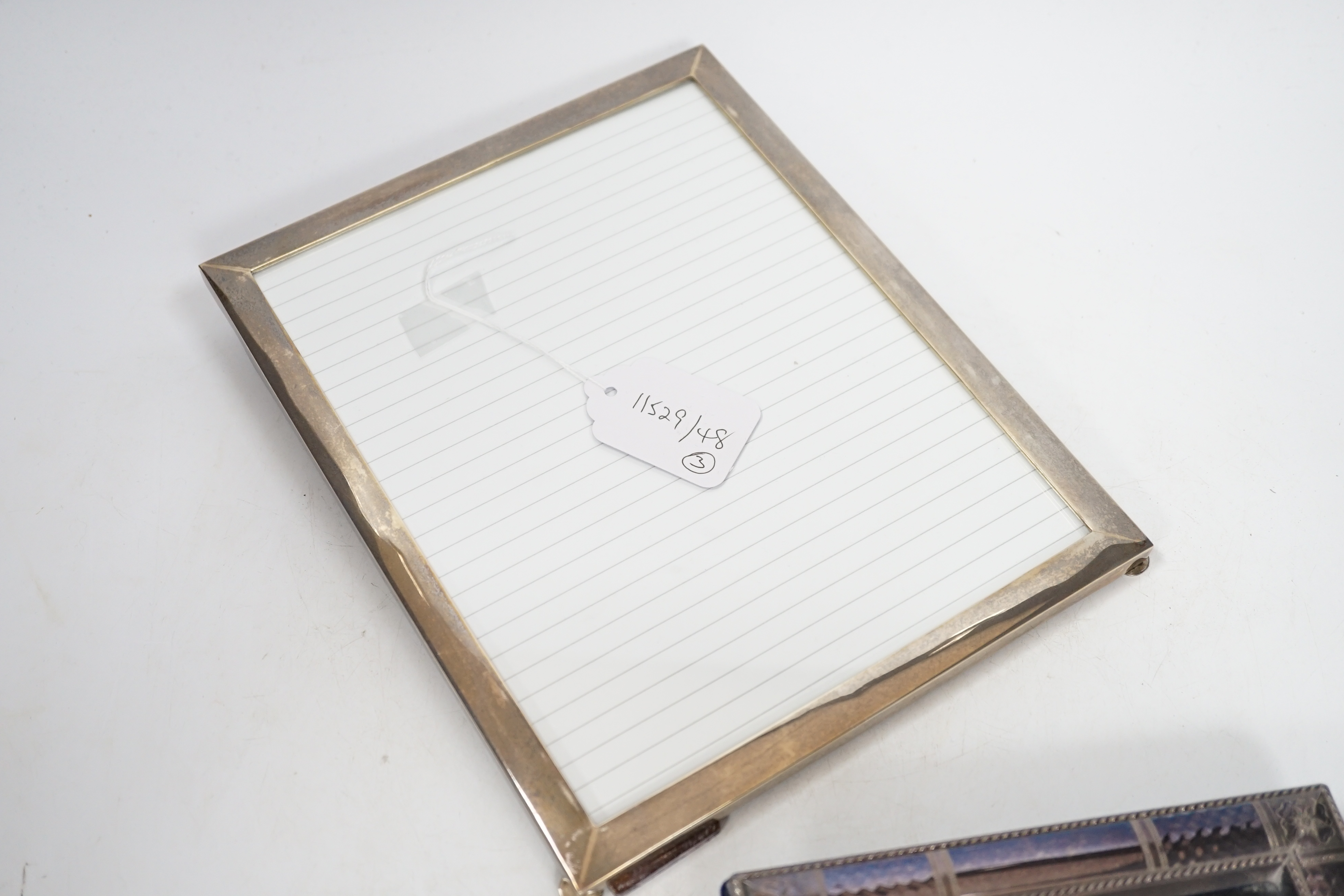Two modern sterling silver mounted photograph frames, 21cm and a larger unmarked frame, 25cm